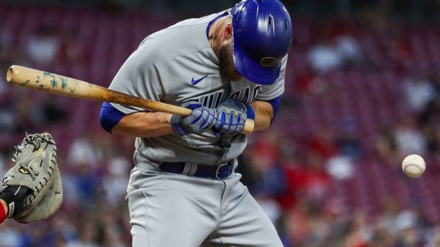 Apr 3, 2023; Cincinnati, Ohio, USA; Chicago Cubs third baseman Patrick Wisdom (16) gets hit by a pitch in the fifth inning against the Cincinnati Reds at Great American Ball Park. Mandatory Credit: Katie Stratman-USA TODAY Sports